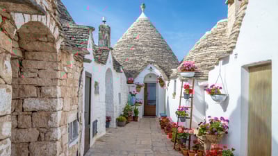 Bing wallpaper August 26, 2025. Trullo buildings in Alberobello, Apulia, Italy (© Feng Wei Photography/Getty Images)