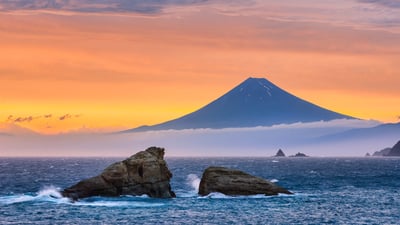 Bing wallpaper July 15, 2019. Mount Fuji and Ushitukiiwa (Twin Rocks) in Matsuzaki, Japan (© Tommy Tsutsui/Getty Images)