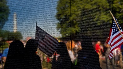 Bing wallpaper May 27, 2019. Visitors at the Vietnam Veterans Memorial in Washington, DC (© Nikki Kahn/Getty Images)