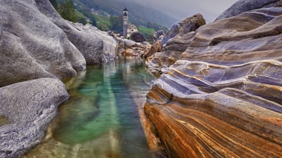 Bing wallpaper February 18, 2021. Rocks in the Verzasca River near the hamlet of Lavertezzo in the Valle Verzasca of Switzerland (© Robert Seitz/Offset by Shutterstock)