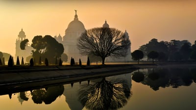 Bing wallpaper November 22, 2023. Beautiful foggy winter sunrise at Victoria Memorial, Kolkata, India. (© DebashisK/Shutterstock)