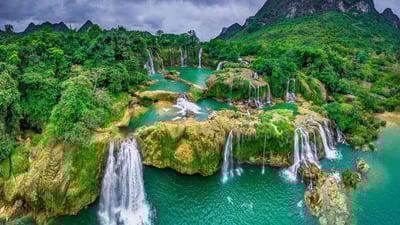 Bing wallpaper January 4, 2025. Bản Giốc–Detian Falls on the Quây Sơn River, Vietnam (© Shane P. White/Minden Pictures)