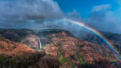 Bing wallpaper March 9, 2023. Rainbow over Waimea Canyon and Waipo'o Falls, Kauai, Hawaii (© Beverley Van Praagh/Getty Images)