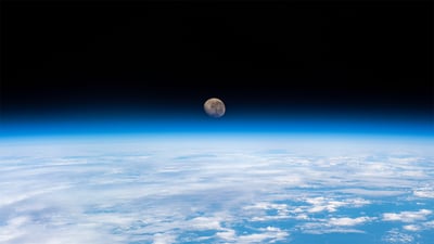 Bing wallpaper April 12, 2022. Waning gibbous moon above the Earth's horizon, photographed from the International Space Station (© NASA)