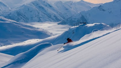 Bing wallpaper January 10, 2022. Skier making a turn in pristine snow in Whistler, B.C. (© stockstudioX/Getty Images)