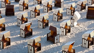 Bing wallpaper July 21, 2024. Strandkörbe auf der Insel Rügen, Deutschland (© Peter Adams/Getty images)