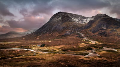 Bing wallpaper March 25, 2021. The Lagangarbh hut nestles in the valley beneath Buachaille Etive Mòr, Glencoe (© Sophia Spurgin Photography/iStock/Getty Images Plus)