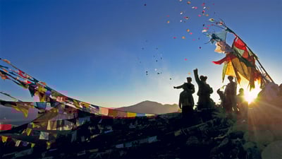 Bing wallpaper February 24, 2020. Pilgrims throwing wind horses into the air above Ganden Monastery for the New Year in Tibet, China (© Ian Cumming/plainpicture)