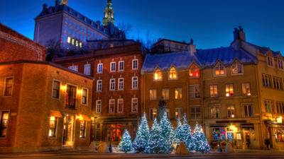 Bing wallpaper December 25, 2025. Christmas trees in Old Quebec (© Jean Surprenant/Getty Images)