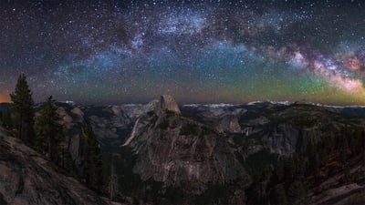 Bing wallpaper April 24, 2022. Milky Way rising above Half Dome in Yosemite National Park, California (© Cory Marshall/Tandem Stills + Motion)