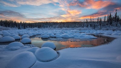 Bing wallpaper January 3, 2021. Red clouds at sunset over McIntyre Creek in Whitehorse, Yukon (© Robert Postma/plainpicture/Design Pics)